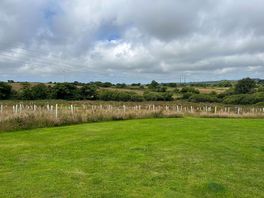 View from the pitch, grass to pitch tents etc. was fairly level but need chocks for large van