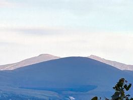 Sun reflecting on snowdon