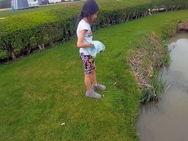 My daughter feeding the carp.