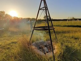 Cooking over the campfire.