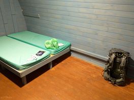 One of the camping pods. double bunkbed and small table just out of frame.