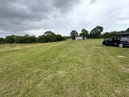 Partial site view , towards entrance , some slope pitches to the left of this picture here.