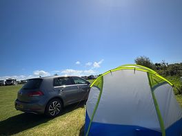 Our pitched up tent in the sun!