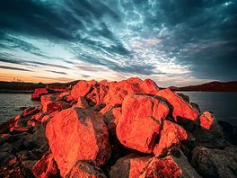 Sunset on the rocks by the edge of the site