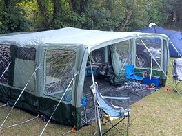 Our tent next to trees.