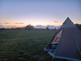 Tent pitched in field