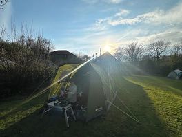 Sunshine over tent pitch