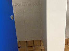 Small shower with grubby shower curtain