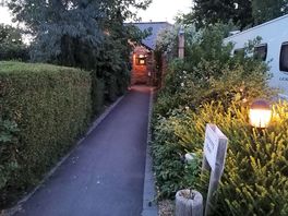Entrance to the shower block at dusk.