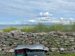 Direct view out of tent. coastal path other side of wall.