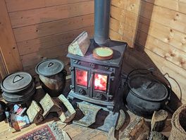 Log burner and wood in the corner