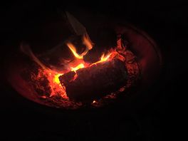 Warming by the fire at dark o’clock