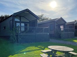 Exterior of our hilltop lodge with your own enclosed balcony.