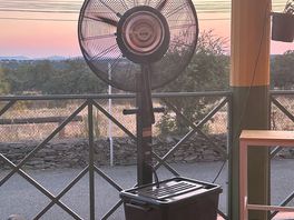 Welcome fan with mister at bar/restaurant.