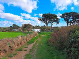 Path to marazion is adjacent to campervan field