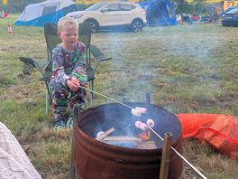 Boys cooking their marshmallows