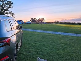 Sun setting towards the coast.