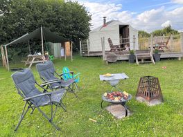 Firepit included on the right. brought along our own bbq. you can hire one on site. merlin yurt.