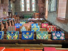 Beautiful embroidered kneelers on display in the church.
