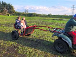 The owner let the kids have a ride around the site, this made their day