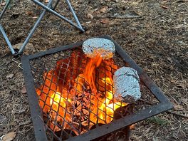 Jacket potatoes on the fire