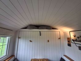 Pull down bed above the dining area