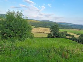Hay baling in the distance