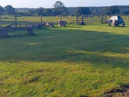 Surrounded by farm land .
