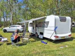 Touring setup next to trees
