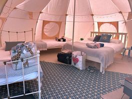 Number 3 bell tent inside set up for a family of 4
