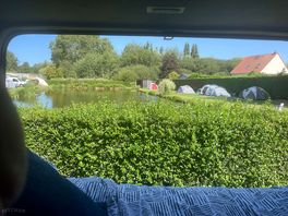View from the van overlooking the small fishing pond on site