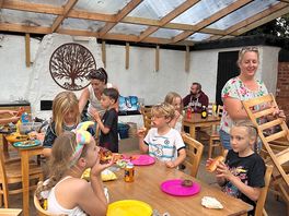 Communal area with 2 bbq areas, washing up, fridge, dining tables, toaster, kettle, cups