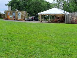 Outside covered eating area with kitchen and communal fridge. adjoining room with charging points