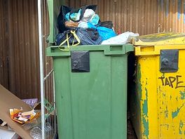 Rubbish bins beside ladies