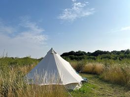 The bell tent with beds in a private camping pitch