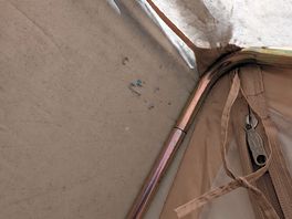 Wear and tear holes near the door.
