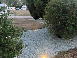 Shrub mood lighting around toilet block