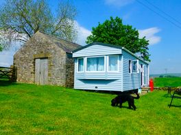 Static sheltered by barn and enclose garden space
