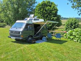 Grass pitch with electric on river side overlooking fields