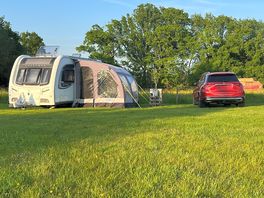 Pitch a. car is parked on pitch, caravan is outside with permission of owner