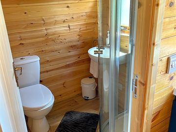 Small bathroom with toilet, sink and hot shower. (added by manager 28 Feb 2024)