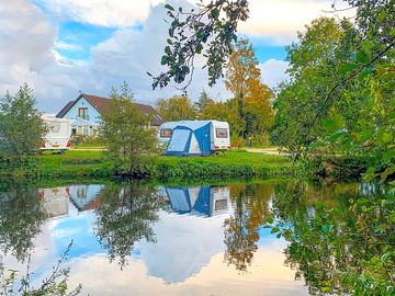 Visitor image of the view of the pitch from across the lake (added by manager 14 Sep 2022)