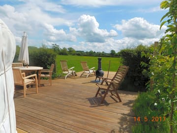 Outdoor deck with furniture and a chimney (added by manager 22 May 2017)