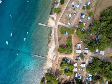 Enjoy the comfort of accommodation in the pine forest, olive grove shade, or right by the sea - the