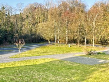 Grass and gravel pitches, all with optional electric hook-up