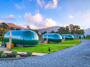 Pods with a mountain backdrop (added by manager 23 Sep 2022)