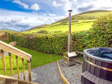 Enclosed private garden and wood fired hot tub with mountain views
