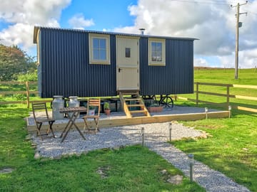 Shepherd's hut with a small gravelled patio area, bistro table, chairs and picnic table (added by manager 07 Feb 2023)
