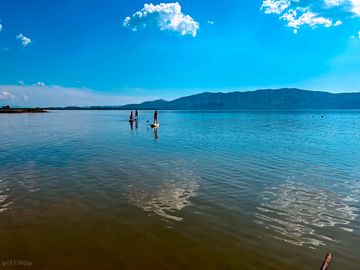 Paddle boarding on lake.