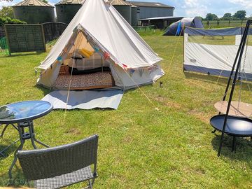 Bell tent with fire pit and outdoor seating